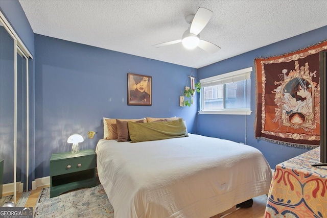 387 Ralph Mcgill Blvd NE Unit K, Atlanta, GA 30312 - bedroom with a textured ceiling, wood finished floors, ceiling fan, and a closet