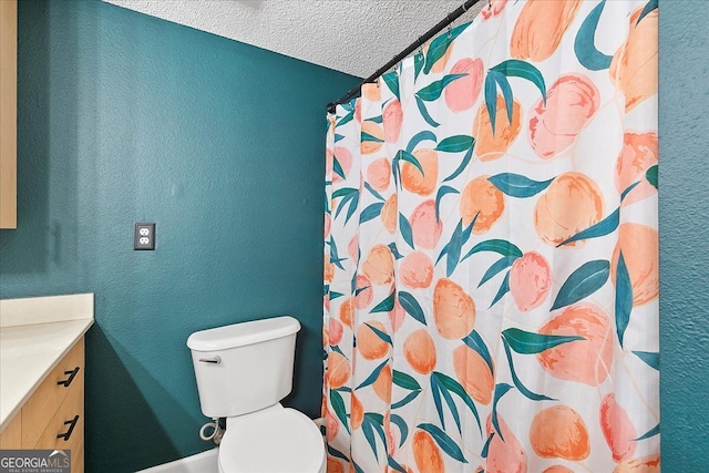 387 Ralph Mcgill Blvd NE Unit K, Atlanta, GA 30312 - full bath with vanity, a textured ceiling, curtained shower, and a textured wall