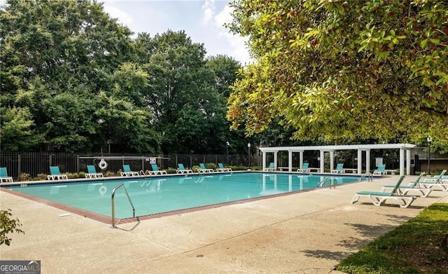 387 Ralph Mcgill Blvd NE Unit K, Atlanta, GA 30312 - community pool featuring a pergola, a patio area, and view of wooded area