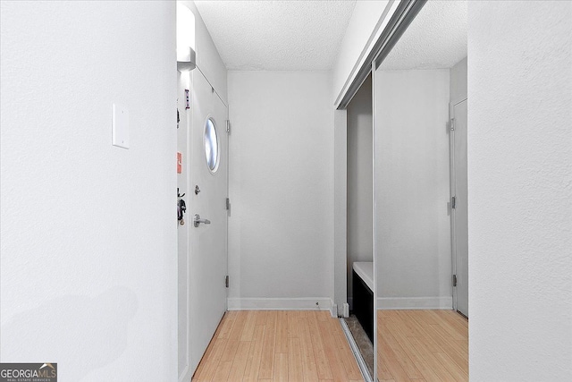 387 Ralph Mcgill Blvd NE Unit K, Atlanta, GA 30312 - hallway with light wood-style flooring and a textured ceiling