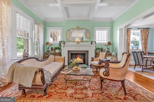403 E Robert Toombs Ave, Washington, GA 30673 - living area featuring wood finished floors, healthy amount of natural light, coffered ceiling, a fireplace, and beam ceiling