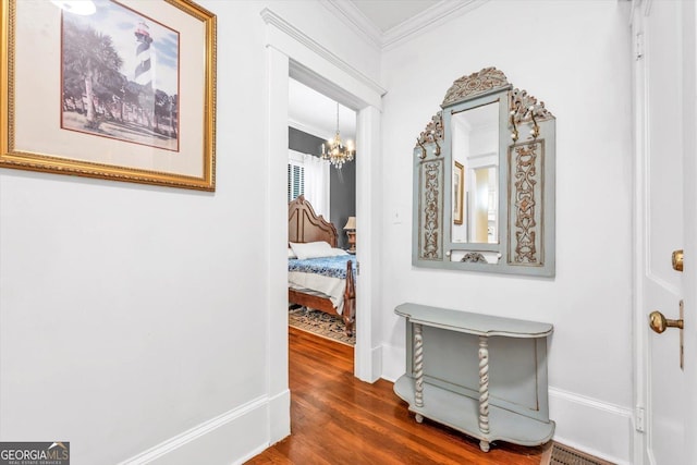 403 E Robert Toombs Ave, Washington, GA 30673 - hallway with crown molding, a chandelier, dark wood-style flooring, and baseboards
