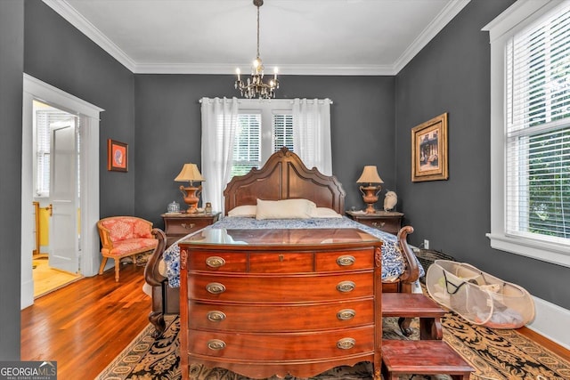 403 E Robert Toombs Ave, Washington, GA 30673 - bedroom with wood finished floors, a chandelier, and crown molding