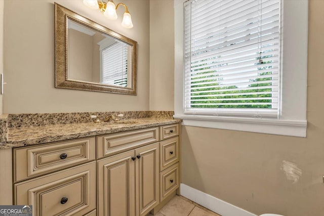 403 E Robert Toombs Ave, Washington, GA 30673 - bathroom with vanity, tile patterned floors, and baseboards