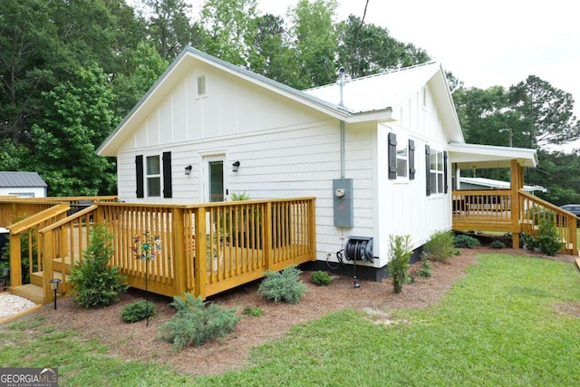 531 Beaver Pond Rd, Carrollton, GA 30117 - back of property featuring board and batten siding, a deck, and a yard