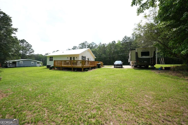 531 Beaver Pond Rd, Carrollton, GA 30117 - view of green lawn featuring a wooden deck