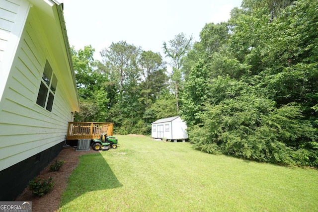 531 Beaver Pond Rd, Carrollton, GA 30117 - view of green lawn featuring a shed and a wooden deck