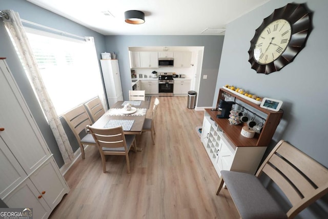 531 Beaver Pond Rd, Carrollton, GA 30117 - dining space with light wood-style floors and baseboards