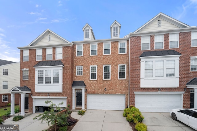 3655 Chattahoochee Summit Dr SE Unit 16, Atlanta, GA 30339 - view of property featuring brick siding, concrete driveway, and a garage
