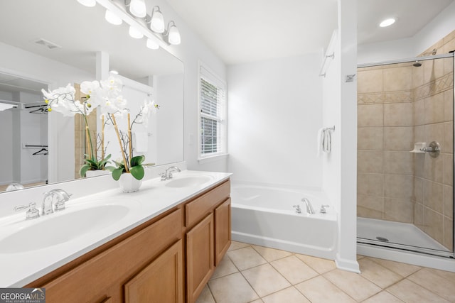 3655 Chattahoochee Summit Dr SE Unit 16, Atlanta, GA 30339 - full bathroom with double vanity, tile patterned floors, a garden tub, and a stall shower