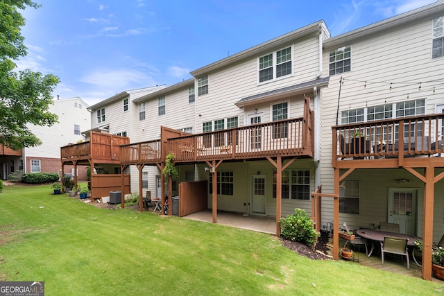 3655 Chattahoochee Summit Dr SE Unit 16, Atlanta, GA 30339 - rear view of house with central AC unit, a lawn, a patio, and a wooden deck