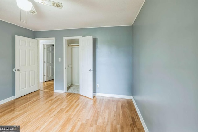 4572 Colonial Rd, Augusta, GA 30907 - unfurnished bedroom with wood finished floors, a closet, and ceiling fan