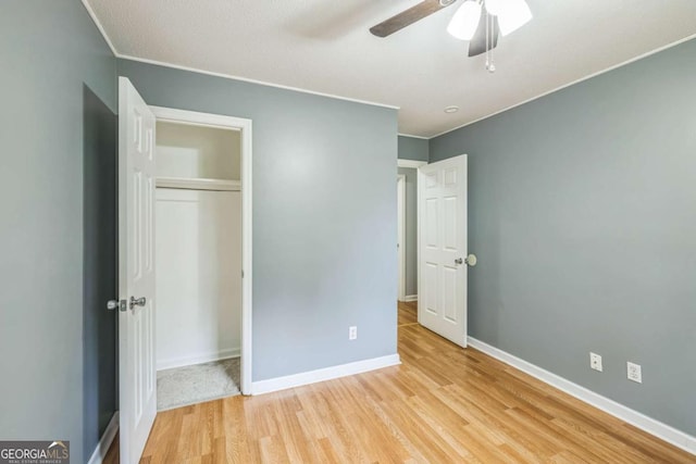 4572 Colonial Rd, Augusta, GA 30907 - unfurnished bedroom with light wood-style floors, a closet, ceiling fan, and crown molding