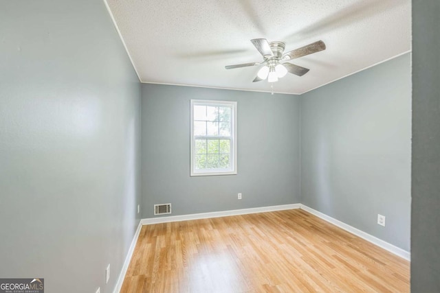 4572 Colonial Rd, Augusta, GA 30907 - unfurnished room with wood finished floors, ceiling fan, and a textured ceiling