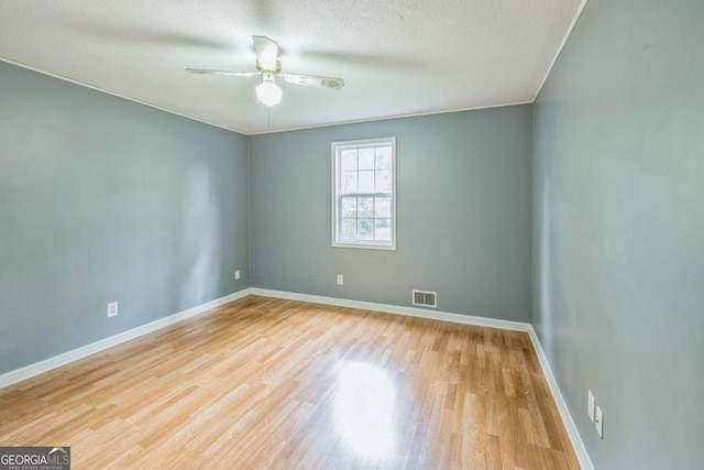 4572 Colonial Rd, Augusta, GA 30907 - unfurnished room with wood finished floors, a ceiling fan, and a textured ceiling