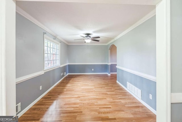 4572 Colonial Rd, Augusta, GA 30907 - spare room with a ceiling fan, arched walkways, wood finished floors, and crown molding