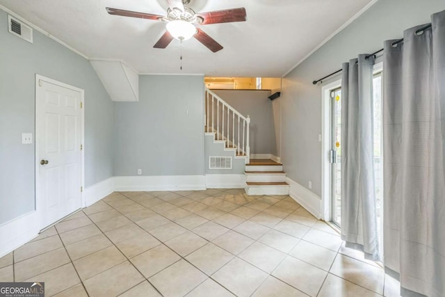 4572 Colonial Rd, Augusta, GA 30907 - spare room with crown molding, ceiling fan, light tile patterned floors, and stairway