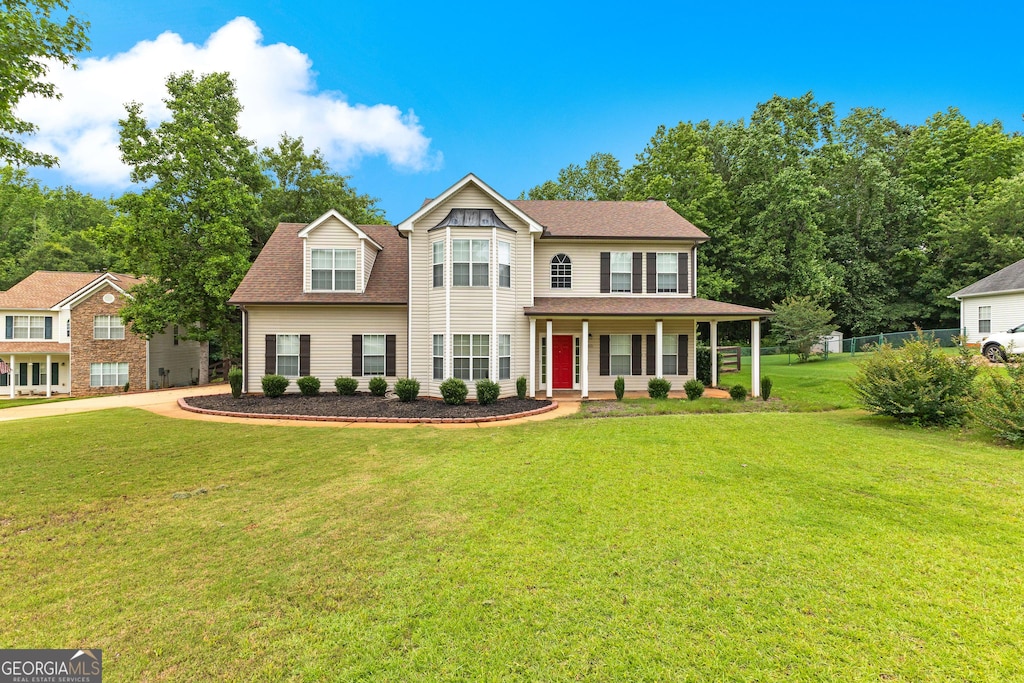 355 Sturgess Run, Sharpsburg, GA 30277 - view of front facade featuring a porch, a front lawn, and roof with shingles