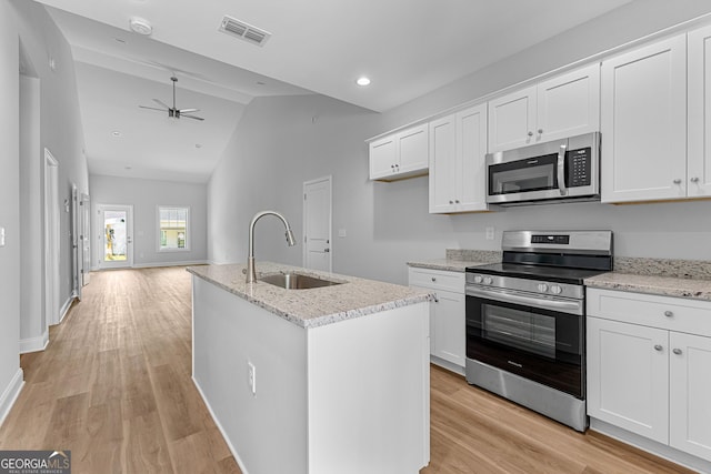 211 Lenox Cir, Lagrange, GA 30241 - kitchen with stainless steel appliances, a sink, vaulted ceiling, light wood-style floors, and ceiling fan