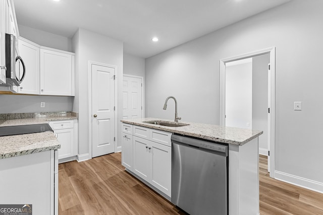 211 Lenox Cir, Lagrange, GA 30241 - kitchen with appliances with stainless steel finishes, a sink, light wood-style floors, white cabinets, and recessed lighting