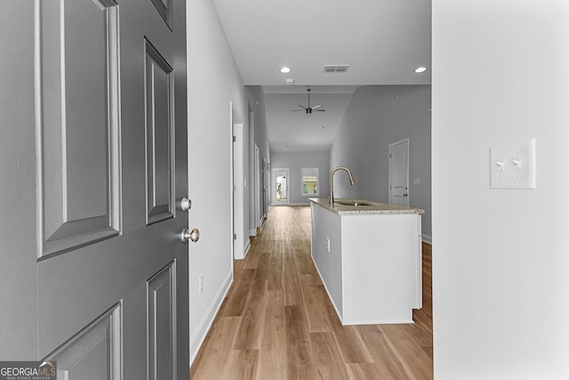 211 Lenox Cir, Lagrange, GA 30241 - hall with a sink, light wood-type flooring, baseboards, and recessed lighting