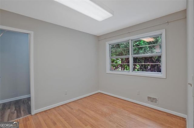 622 Sheffield Rd, Norcross, GA 30071 - unfurnished room with wood finished floors and baseboards