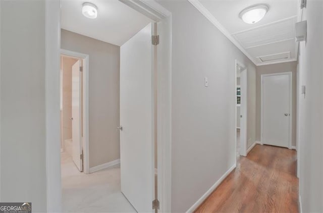 622 Sheffield Rd, Norcross, GA 30071 - corridor featuring light wood finished floors, baseboards, and attic access