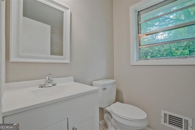622 Sheffield Rd, Norcross, GA 30071 - half bathroom with toilet, vanity, and baseboards
