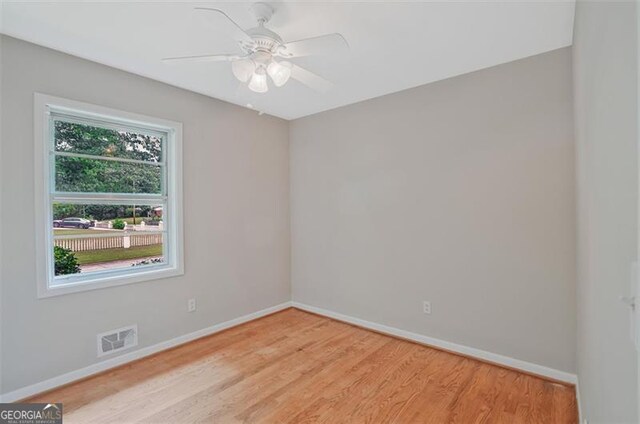 622 Sheffield Rd, Norcross, GA 30071 - spare room with baseboards, light wood-type flooring, and ceiling fan