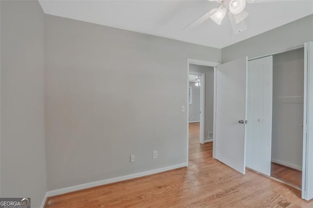 622 Sheffield Rd, Norcross, GA 30071 - unfurnished bedroom featuring light wood-style flooring, a closet, baseboards, and ceiling fan