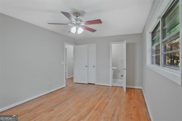 622 Sheffield Rd, Norcross, GA 30071 - unfurnished bedroom featuring baseboards, light wood-style floors, a ceiling fan, and ensuite bathroom