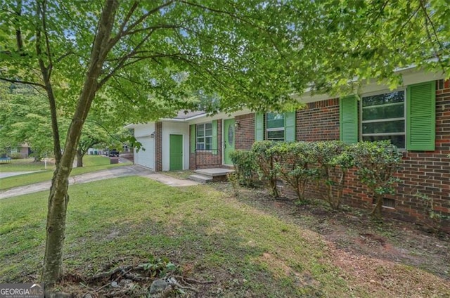 622 Sheffield Rd, Norcross, GA 30071 - view of property hidden behind natural elements with brick siding, an attached garage, driveway, and a front yard