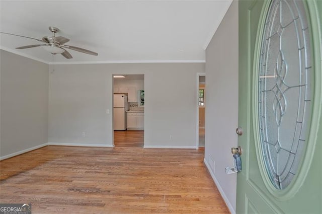 622 Sheffield, Norcross, GA 30071 - foyer entrance featuring crown molding, a ceiling fan, and light wood-style floors
