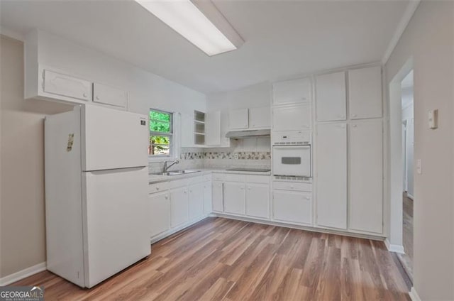 622 Sheffield Rd, Norcross, GA 30071 - kitchen featuring white appliances, white cabinetry, light wood-style flooring, and light countertops