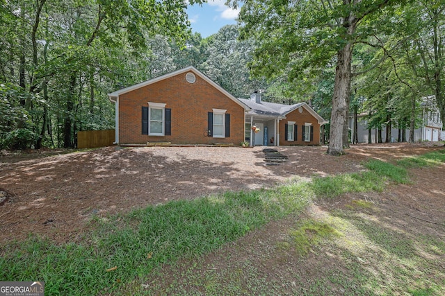 4180 Gables Pl, Buford, GA 30519 - view of front facade featuring brick siding and a chimney