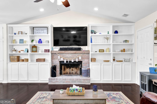 4180 Gables Pl, Buford, GA 30519 - living room featuring ceiling fan, vaulted ceiling, dark wood-style floors, and a fireplace