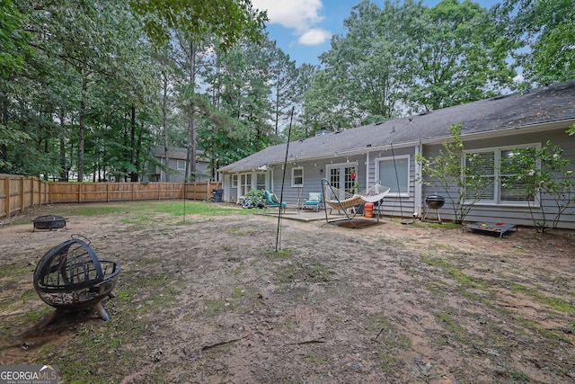 4180 Gables Pl, Buford, GA 30519 - rear view of property featuring an outdoor fire pit, a fenced backyard, and a patio area