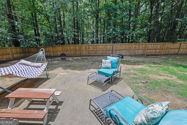 4180 Gables Pl, Buford, GA 30519 - fenced backyard with a patio area and a fire pit