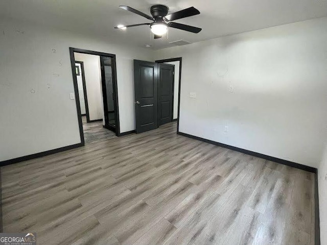 185 Glenrose Cir SW, Atlanta, GA 30354 - spare room featuring light wood-style flooring and a ceiling fan
