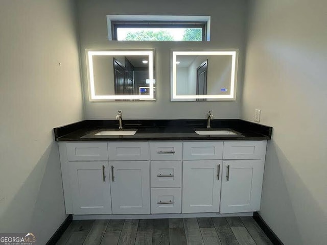 185 Glenrose Cir SW, Atlanta, GA 30354 - full bathroom with double vanity and wood finished floors