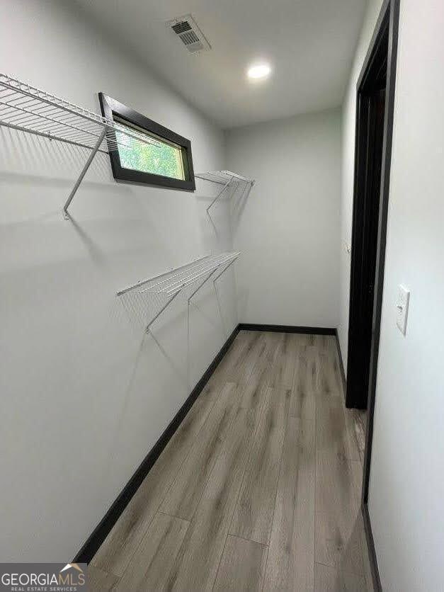 185 Glenrose Cir SW, Atlanta, GA 30354 - spacious closet with light wood-style flooring