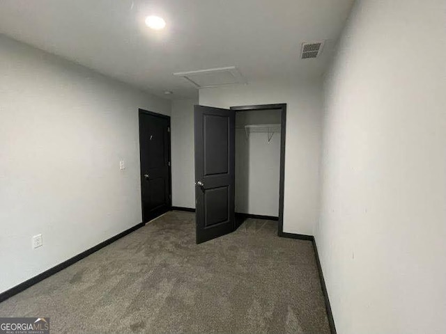 185 Glenrose Cir SW, Atlanta, GA 30354 - unfurnished bedroom with attic access, carpet flooring, and a closet