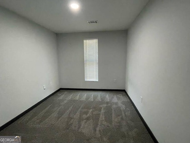 185 Glenrose Cir SW, Atlanta, GA 30354 - carpeted spare room with baseboards