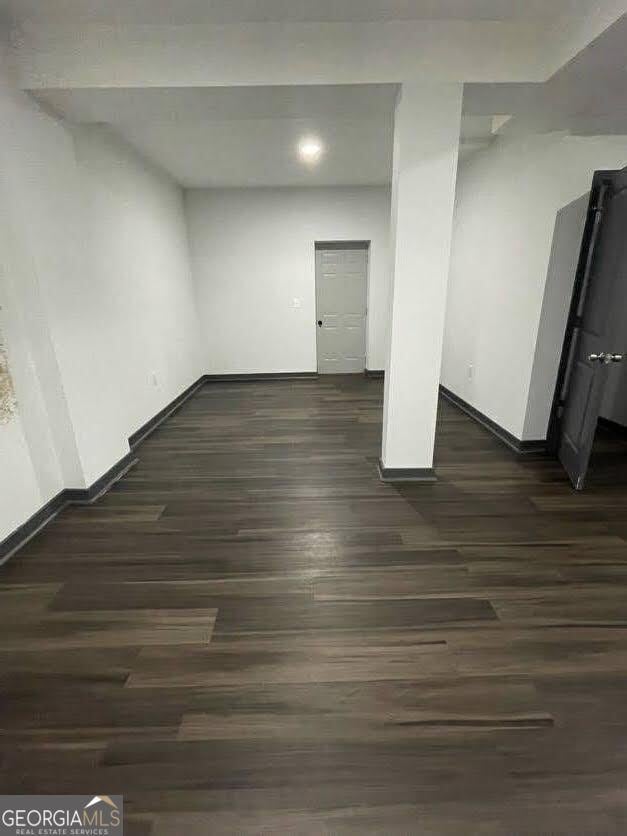 185 Glenrose Cir SW, Atlanta, GA 30354 - below grade area featuring baseboards and dark wood-style flooring