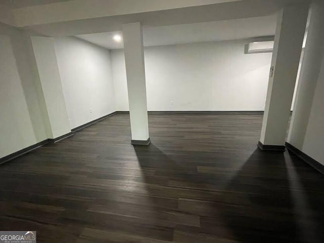 185 Glenrose Cir SW, Atlanta, GA 30354 - finished below grade area featuring dark wood-style flooring, recessed lighting, and a wall mounted air conditioner