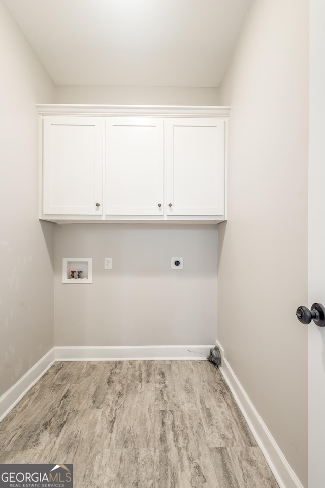 104 Bonny Oaks Dr, Lagrange, GA 30240 - laundry room with hookup for an electric dryer, hookup for a washing machine, wood finished floors, and cabinet space