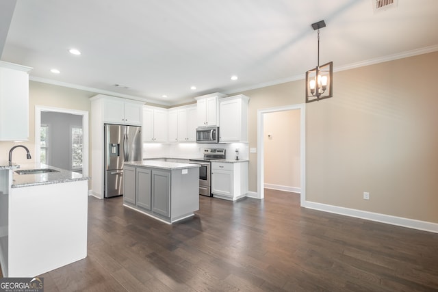 104 Bonny Oaks Dr, Lagrange, GA 30240 - kitchen featuring stainless steel appliances, ornamental molding, dark wood-style floors, recessed lighting, and light stone countertops