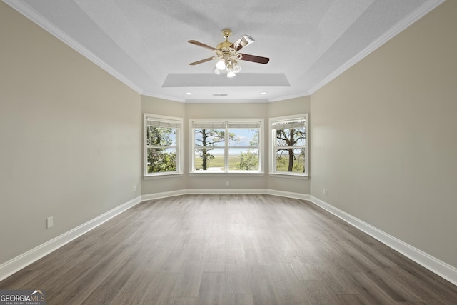 515 Youmans Rd, Midway, GA 31320 - unfurnished room featuring a ceiling fan, dark wood-type flooring, a tray ceiling, baseboards, and recessed lighting