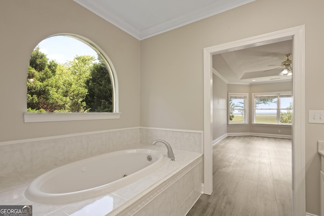 515 Youmans Rd, Midway, GA 31320 - bathroom with a tub with jets, crown molding, a ceiling fan, and wood finished floors
