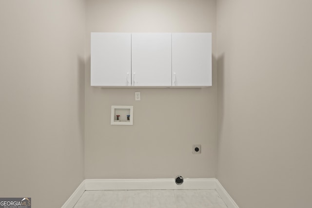 515 Youmans Rd, Midway, GA 31320 - laundry room with washer hookup, hookup for an electric dryer, baseboards, and cabinet space